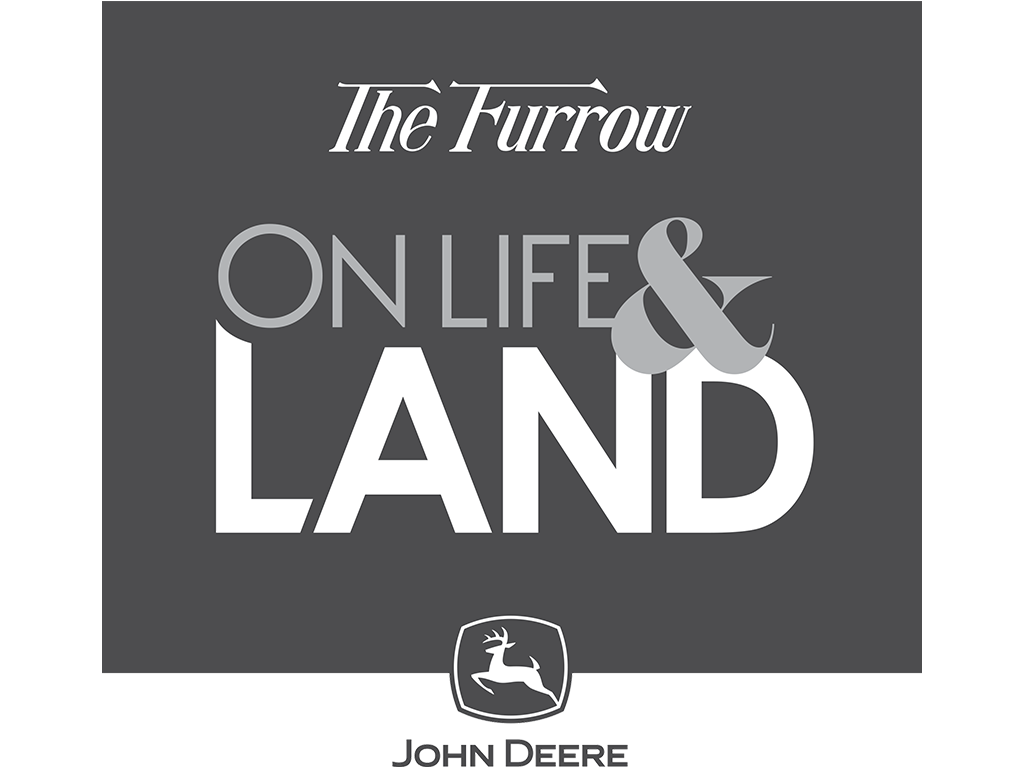John Deere logo with the words The Furrow On Life & Land above in grey and white