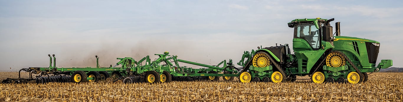 Side view of autonomous 9RX 640 tractor with 2660VT tillage working in the field