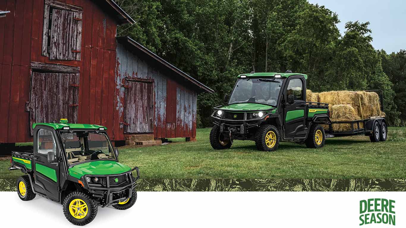 Gator Utility Vehicle hauling hay bales to a barn.