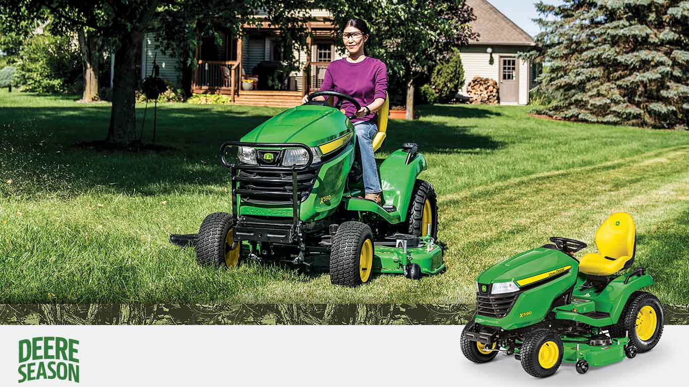 person on a X590 Lawn Tractor cutting grass.