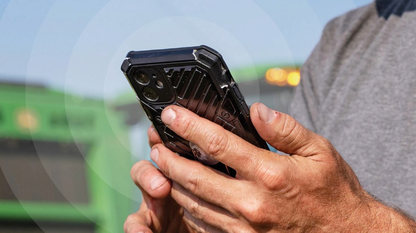 person's hands holding a cell phone