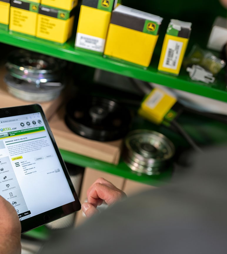 A dealer inspecting parts inventory