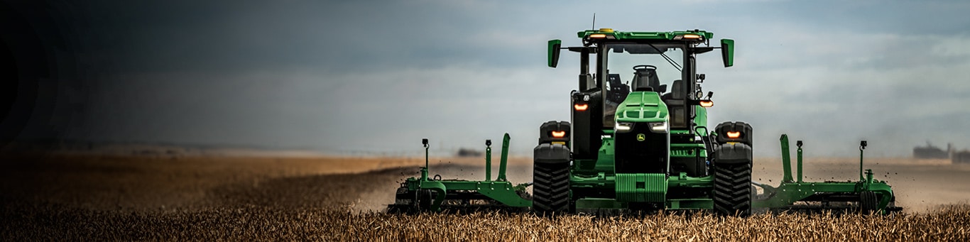 Autonomous 8RX Tractor tilling a field.