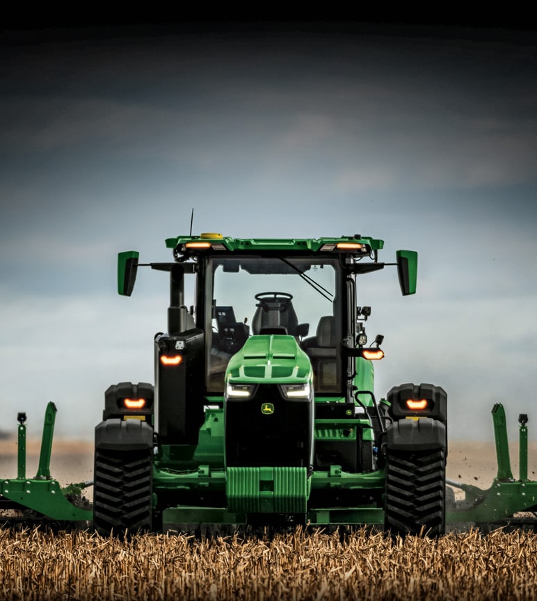 Autonomous 8RX Tractor tilling a field.