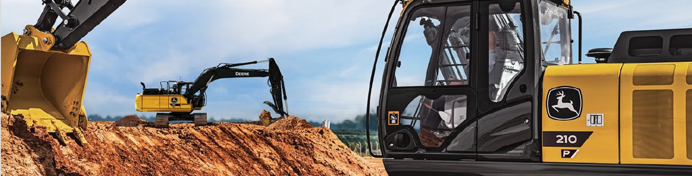 210P Excavator digging into wall of dirt