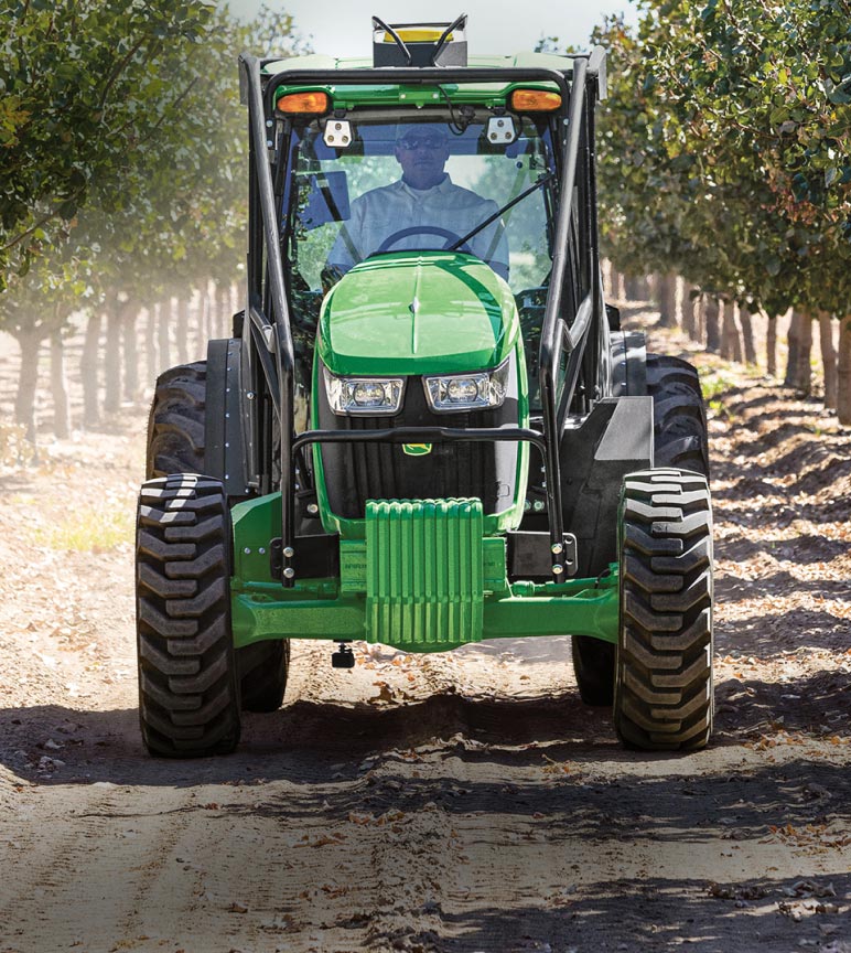 Tractor driving through a vineyard