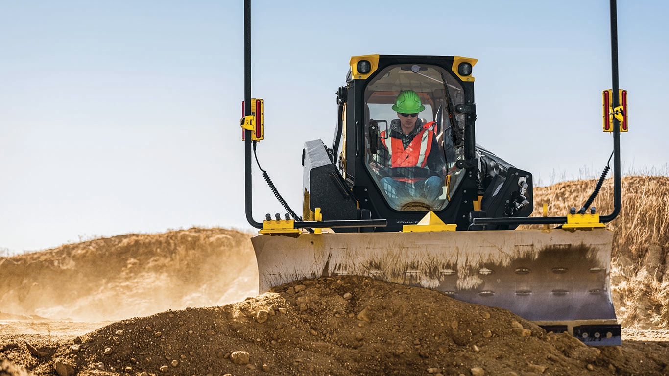  333 P-Tier compact track loader moving a large mound of dirt around a jobsite