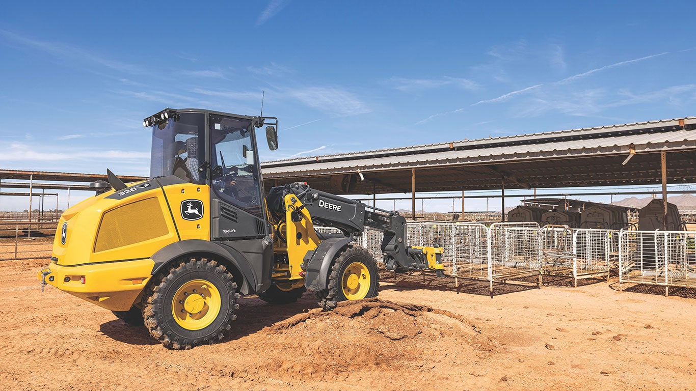 The John&nbsp;Deere 326 P-Tier Telescopic Loader moving a fence on the jobsite