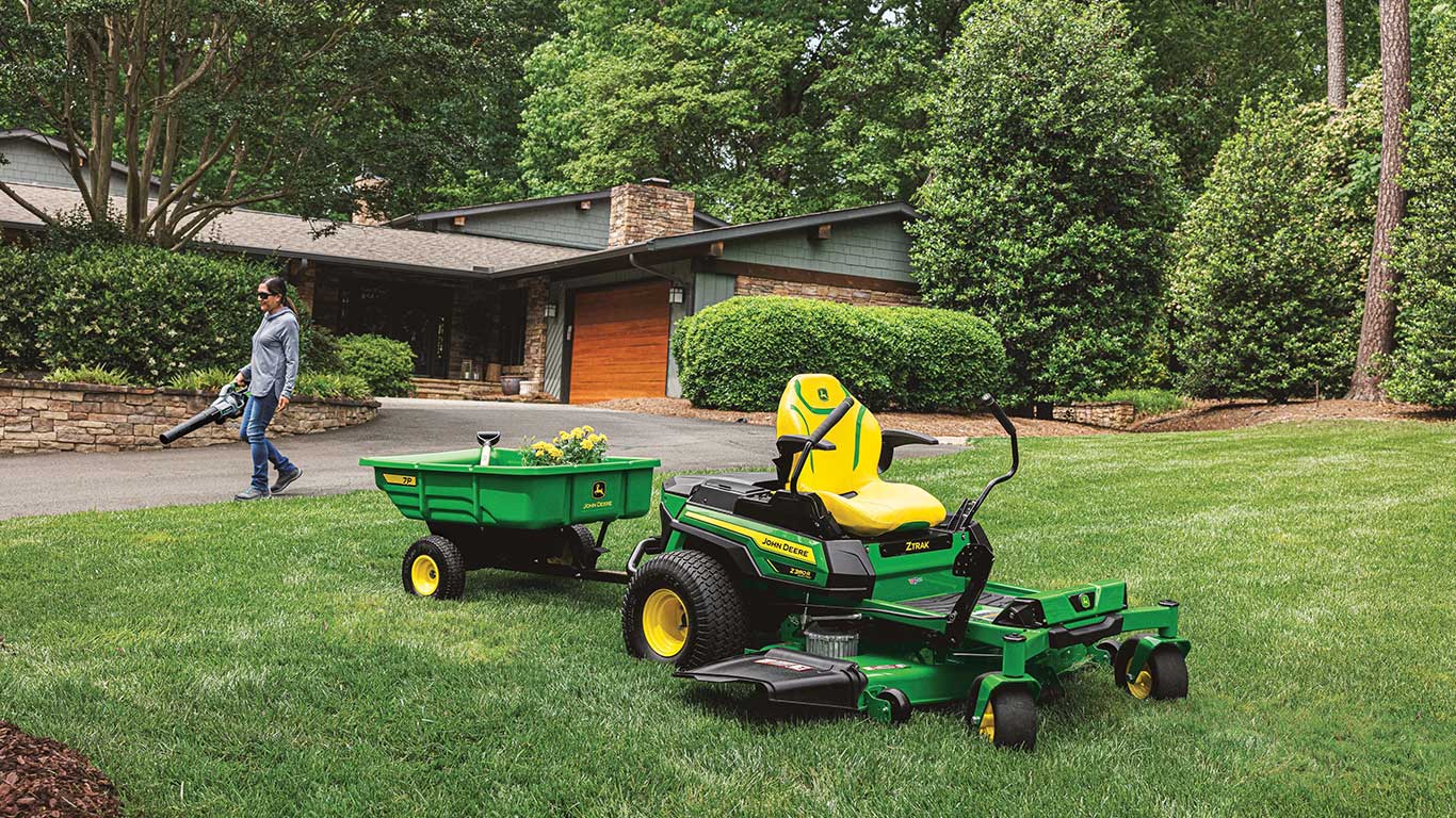 Z380R Electric on lawn pulling a utility cart with flowers