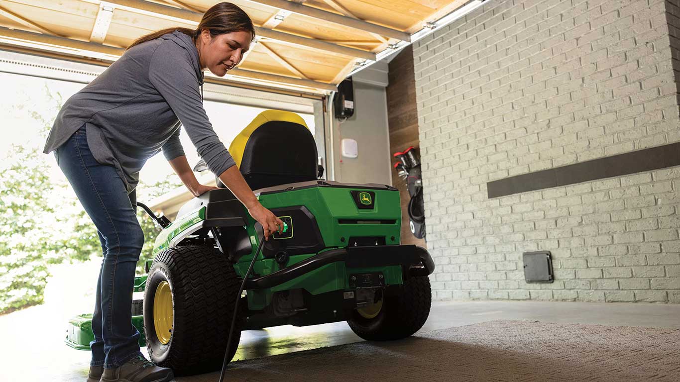 Z380R Electric Mower plugged in to charge in a garage