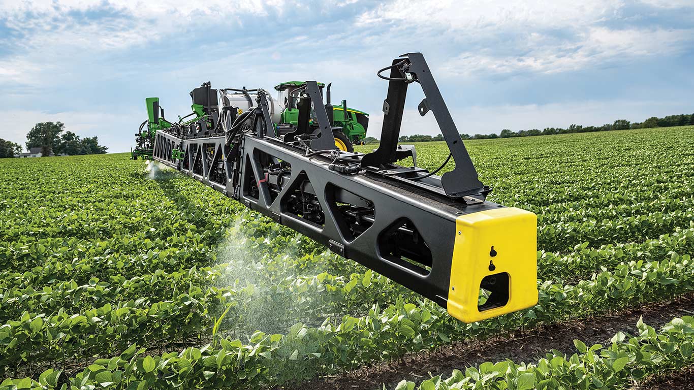 John Deere sprayer with See and Spray Ultimate spraying in a soybean field.