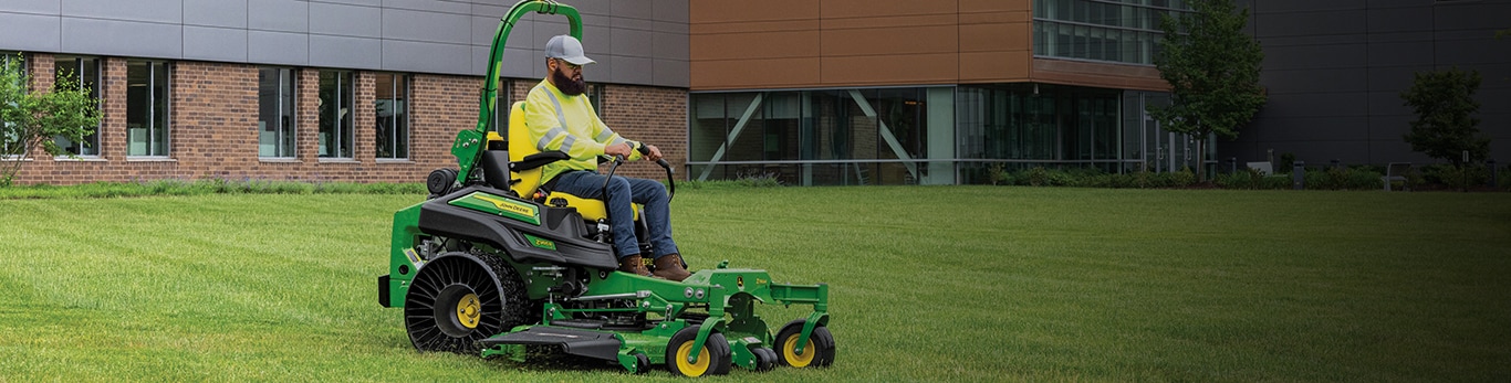 Man driving a z985r through the lawn