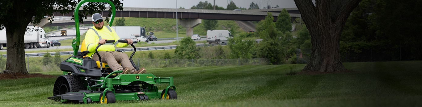 Man driving a z975m through the lawn