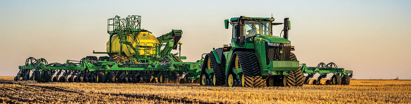 John Deere air seeder and tractor at work in the field