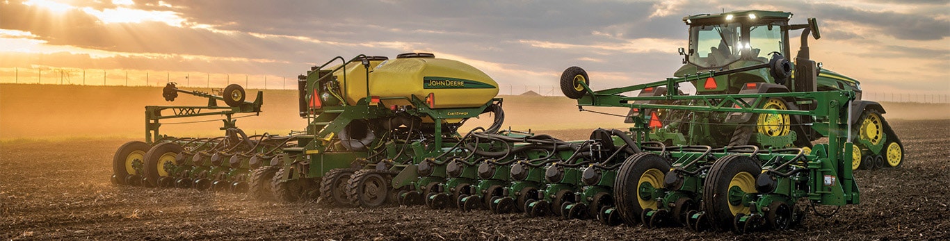  John Deere planter and tractor at work on the farm