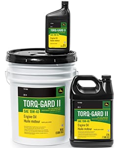 Torq-Gard™ II engine oil with a green and yellow label, shown in a white 5-gallon bucket with black lid, black 1-gallon jug, and black 1-quart container