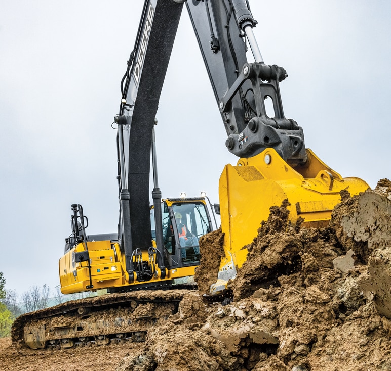 John Deere 350 P-Tier excavator digs a hole