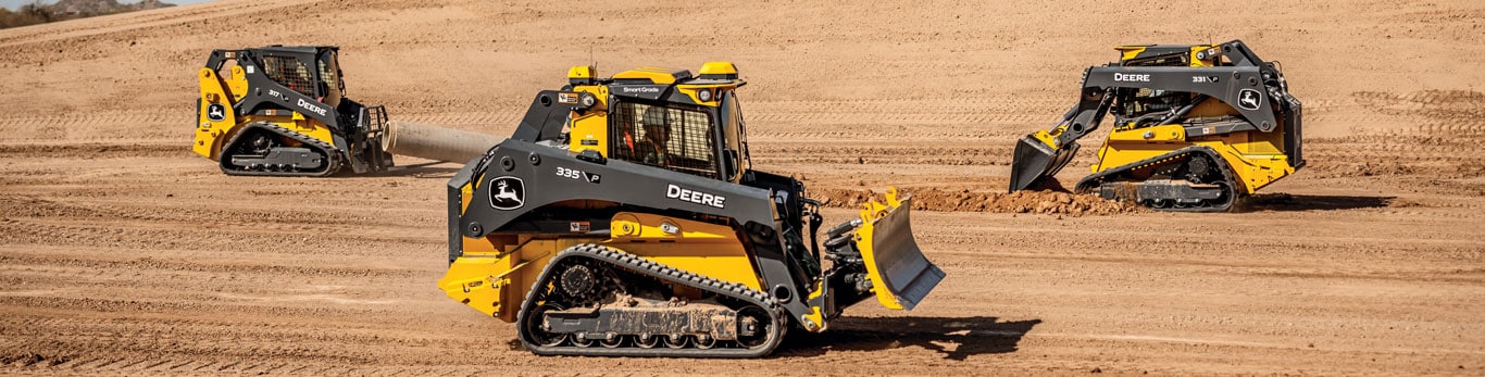 317 P-Tier, 335 P-Tier and 331 P-Tier Compact Track Loaders drive across a jobsite