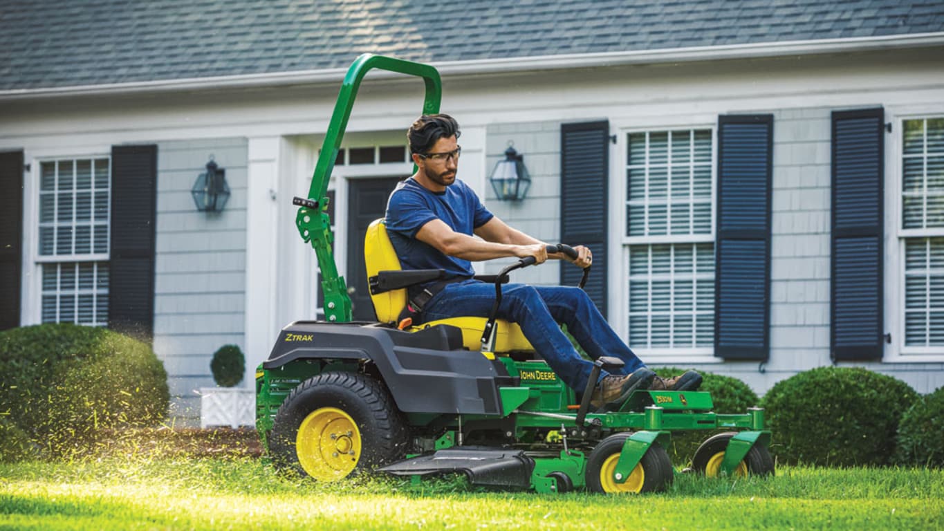 a person mowing his lawn in an Z530M Mower