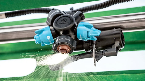 Close-up photograph of Individual Nozzle Control Pro spraying.