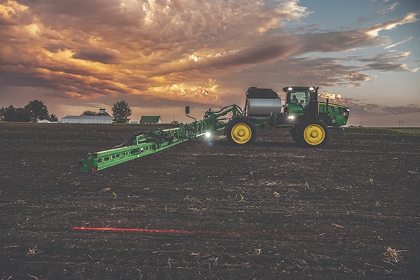 Night shot of a sprayer with lite LED Boom and Vehicle Lighting Precision Upgrade.