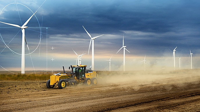 A John Deere 872GP Motor Grader levels the surface of a wind farm in Montana, where Blattner Energy is creating forward-looking renewable-energy solutions.