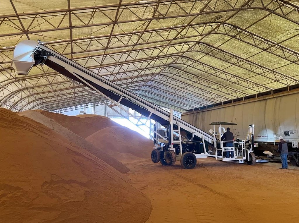 Gruber Manufacturing material conveyor on a jobsite.