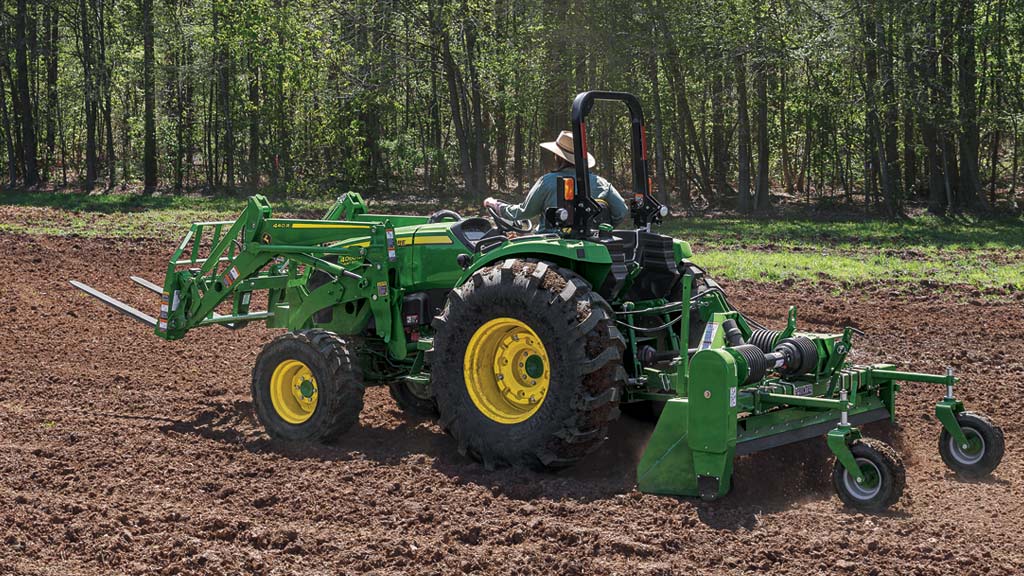 Person tilling ground on a 4066HD Compact Tractor