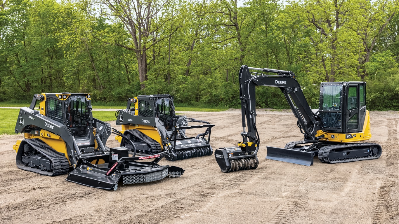 Compact track loaders and a compact excavator with cutter and mulcher attachments