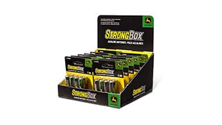 Display box of John Deere StrongBox alkaline batteries in assorted sizes.