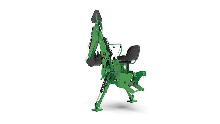 A rear-left-facing studio shot of a green backhoe implement on a white background. (5th thumbnail)