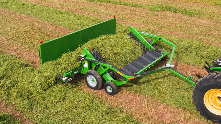 field image of Frontier™ HM11 hay merger attached to a tractor