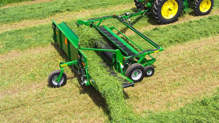 field image of Frontier™ HM12 hay merger attached to a tractor