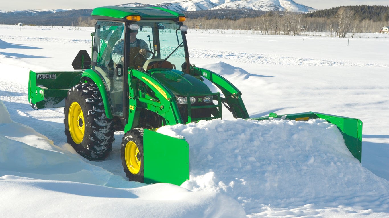 field image of as11e series snow push on a tractor in the snow