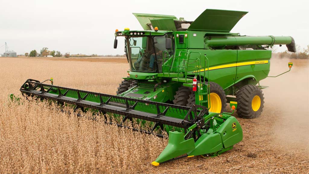 Photo of a John Deere Combine harvesting small grains with an auger platform