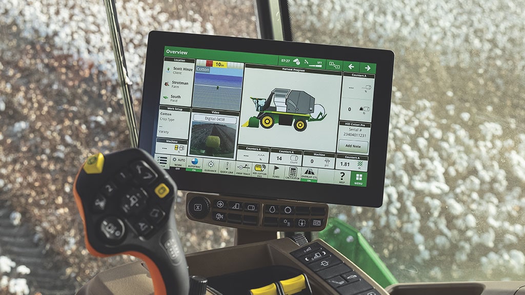 a close-up shot of a G5Plus display in the cab of a John Deere cotton harvester