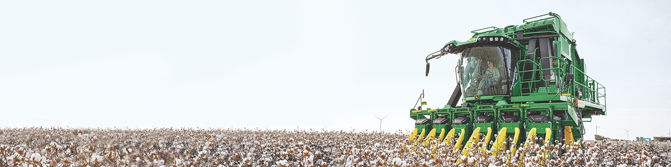 Front shot of a John Deere CP770 Cotton Picker harvesting cotton in a field