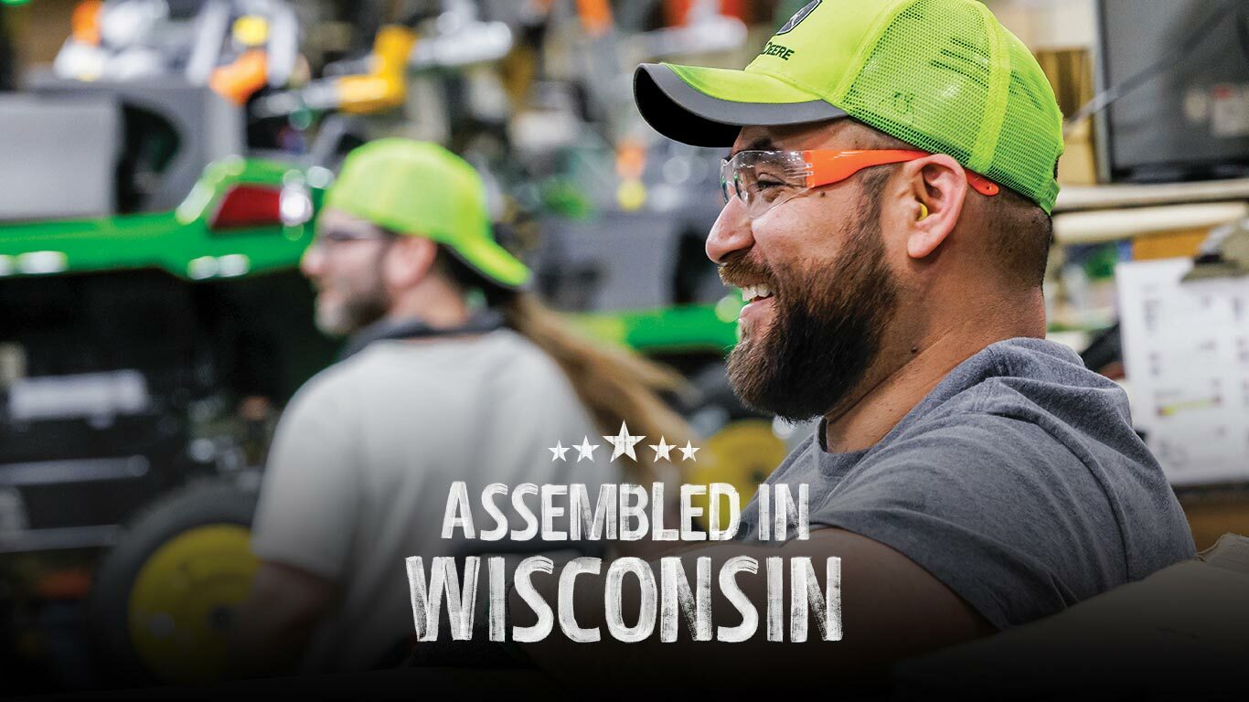 Team members near the assembly line at the John Deere factory in Wisconsin.