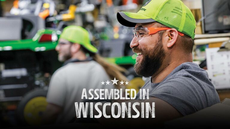 Team members near the assembly line at the John Deere factory in Wisconsin.