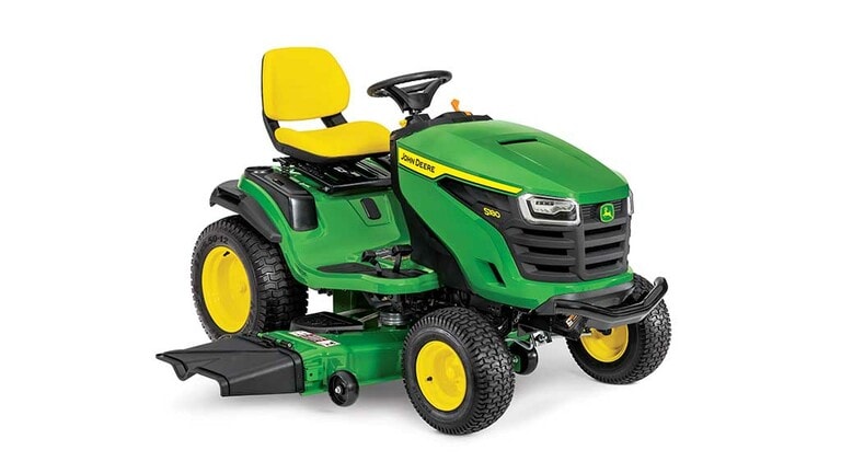 A front-right-facing green riding mower with a yellow seat and green mowing deck on a white background. (5th thumbnail)
