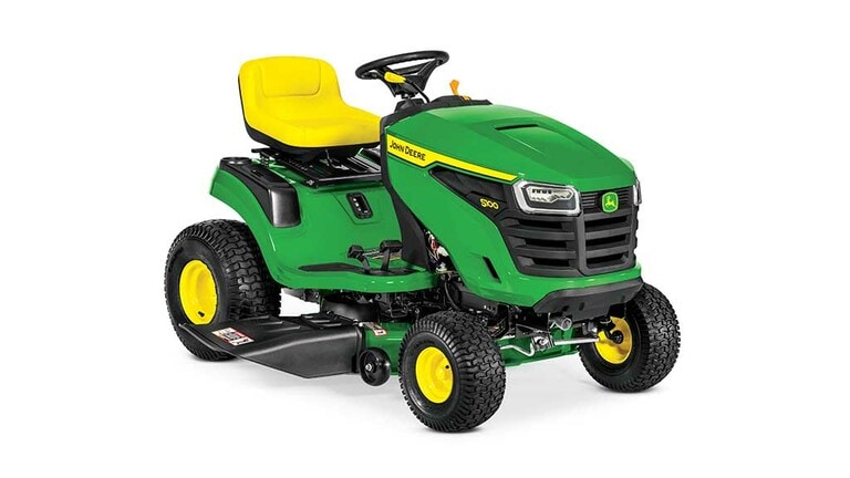 A front-right-facing green riding mower with a yellow seat and green mowing deck on a white background. (4th thumbnail)