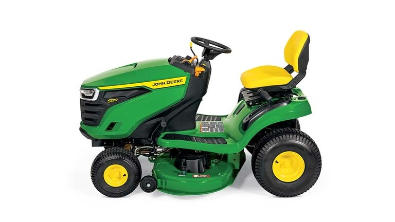 A left-facing green riding mower with a yellow seat and green mowing deck on a white background. (4th thumbnail)