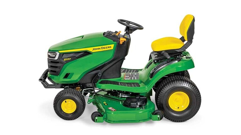 A left-facing green riding mower with a yellow seat and green 48" mowing deck on a white background. (9th thumbnail)