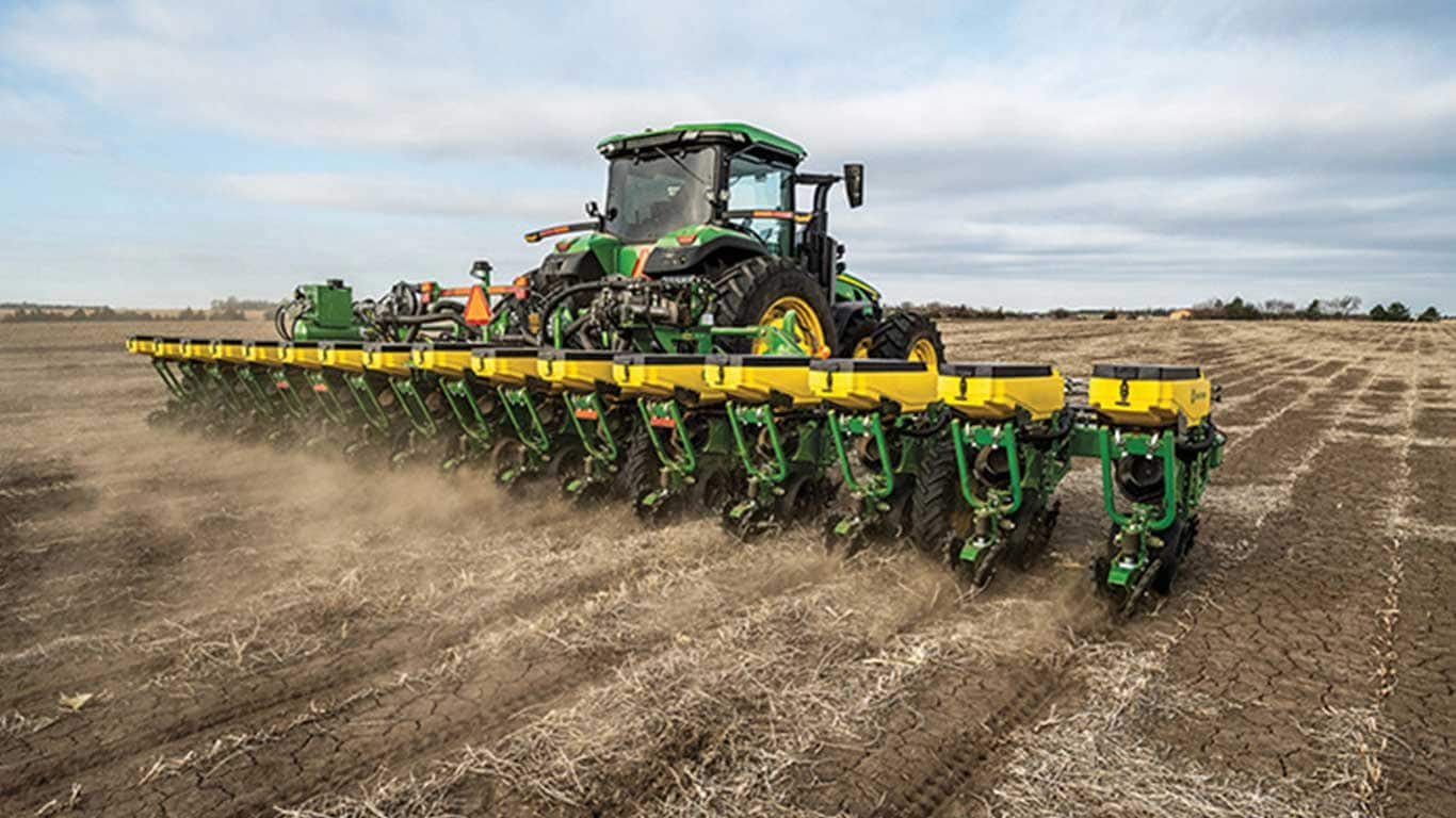 8 Series Tractor with planter in field