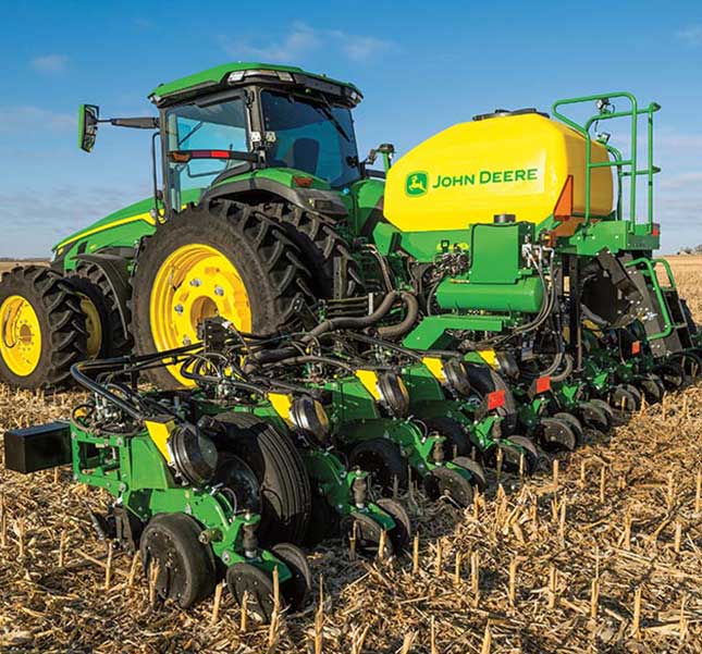 8 Series Tractor with a mounted 1725C planter in field