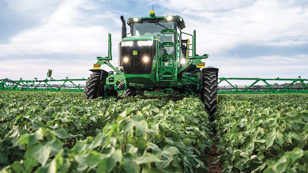 Increased Yields Self-propelled sprayer target spraying herbicide in soybean field.