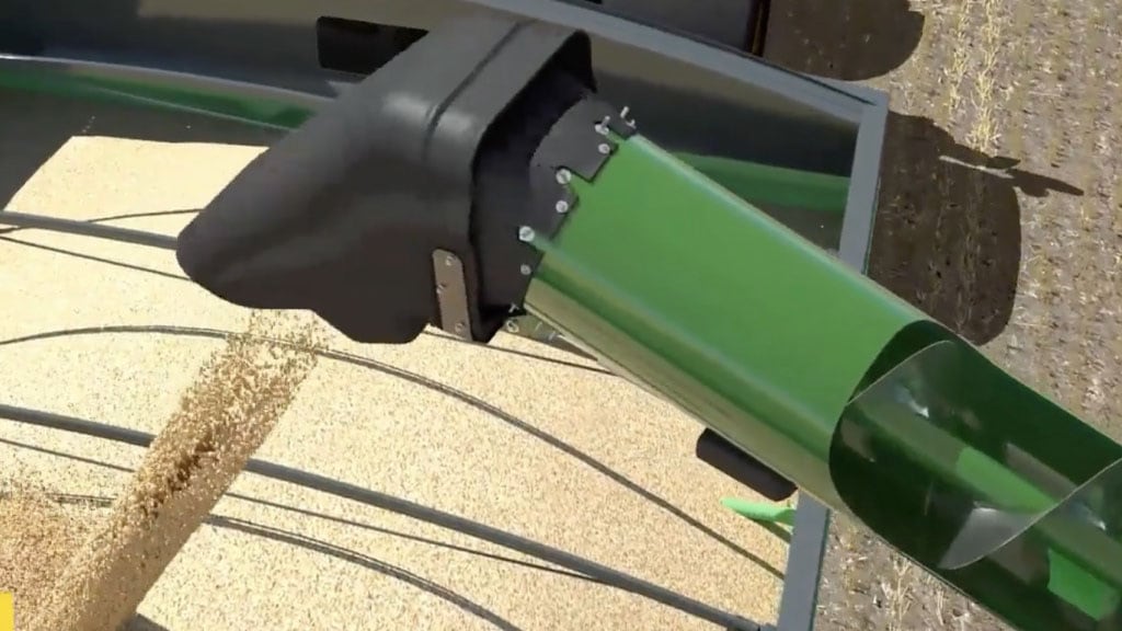 Overhead shot of an auger on a John Deere combine unloading grain into a grain cart.