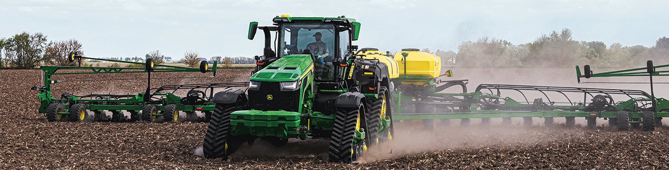High-horsepower 8RX Tractor tilling a field.