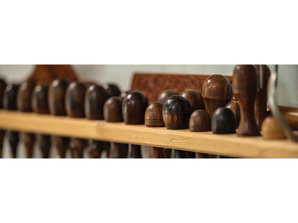 closeup of the wooden handles of leather carving tools