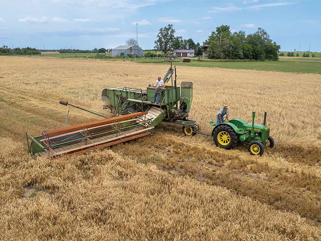 John&nbsp;Deere Model 36 pulled by a D tractor in the field. 